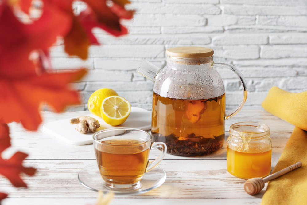 Brewed green tea in a glass teapot
