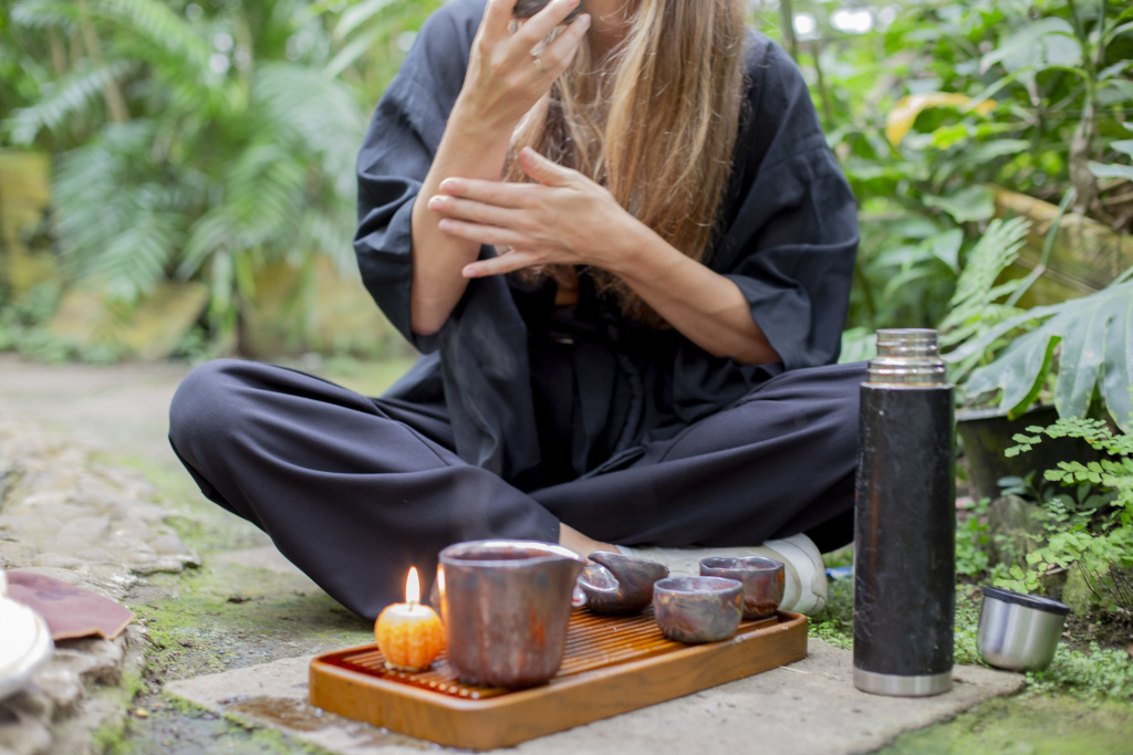 Woman enjoying tea during an outdoor ceremony